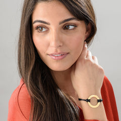 Infinity bracelet with circular pattern in gold plating